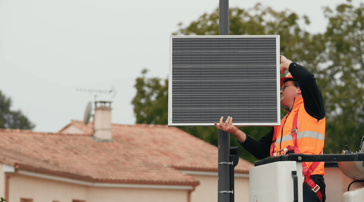 Installation of a solar panel on a mast.